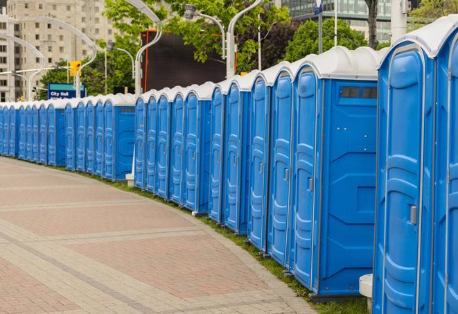 a line of portable restrooms set up for a wedding or special event, ensuring guests have access to comfortable and clean facilities throughout the duration of the celebration in Boxford MA