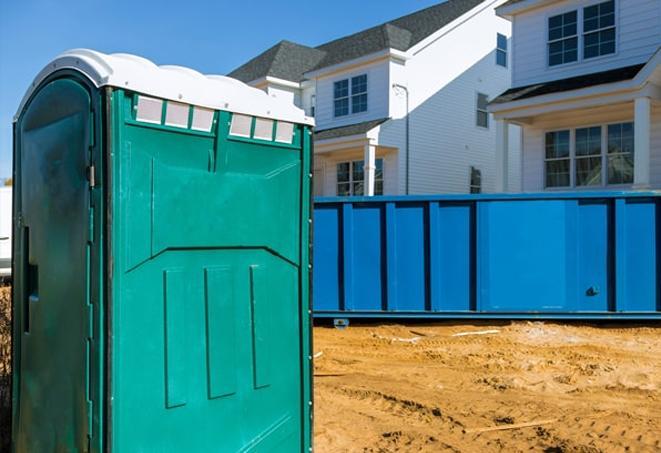 a row of porta potties for construction workers on site